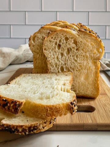 Sliced sourdough bread on a cutting board.