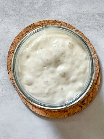Overhead view of sourdough starter in a jar.