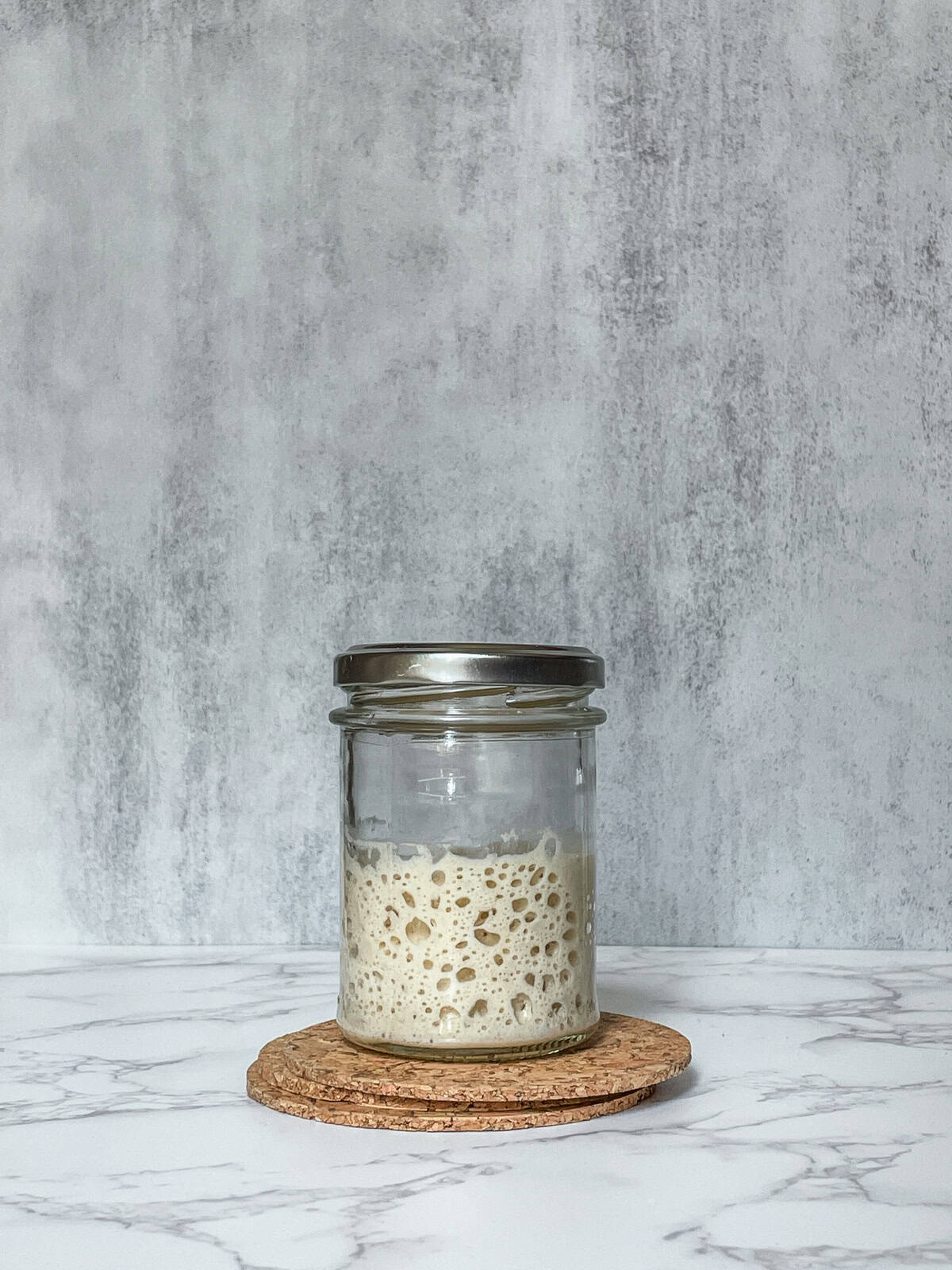 Jar of rehydrated sourdough starter.