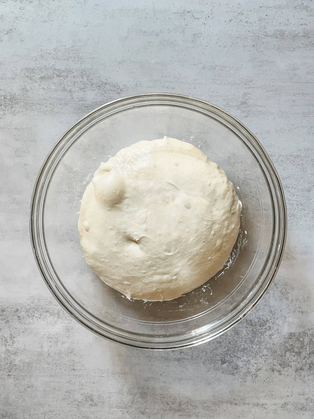 Top of the dough showing large bubbles.