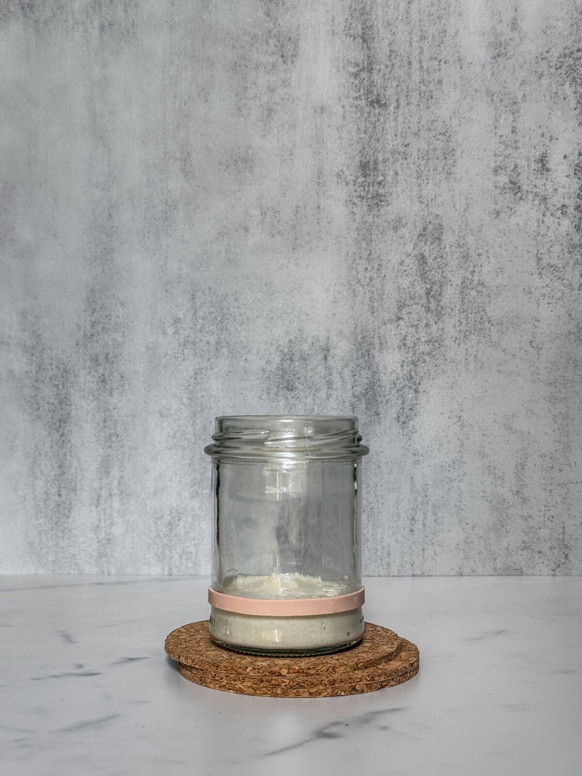 Jar with starter ingredients fully mixed (front view).