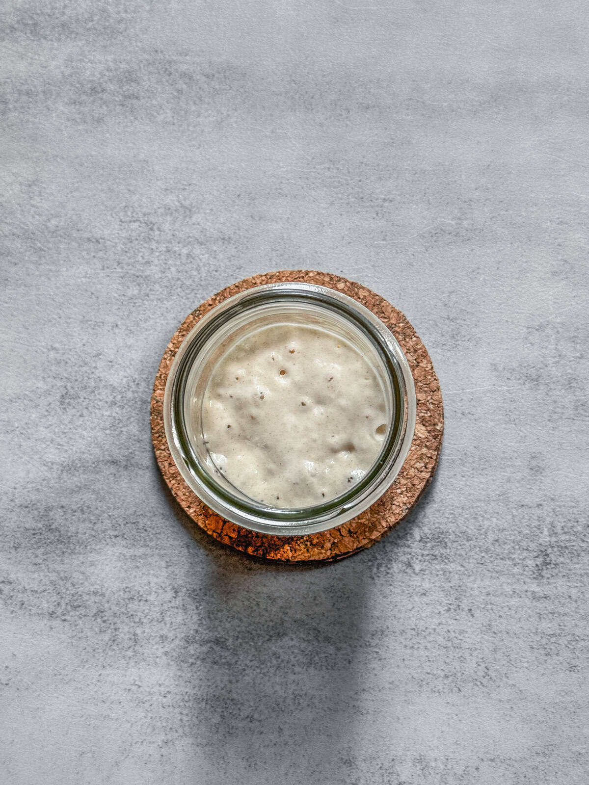 Jar of sourdough starter on day 5 evening, overhead view.