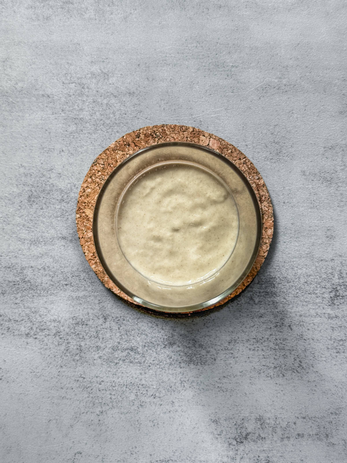 Jar of sourdough starter on day 4 evening after mixing, overhead view.