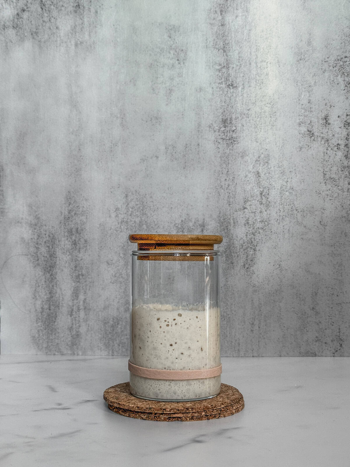 Jar of sourdough starter on day 4 evening, front view.