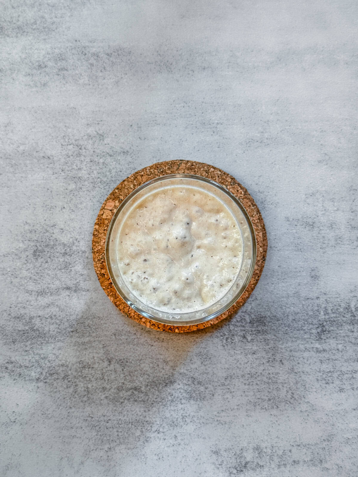 Jar of sourdough starter on day 4 evening, overhead view.