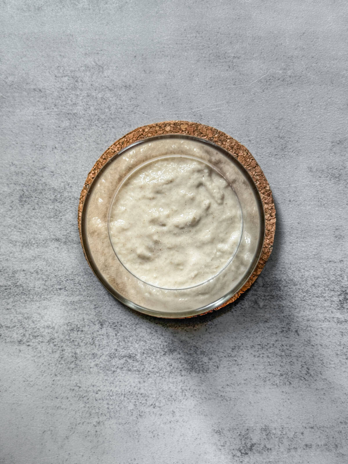 Jar of sourdough starter on day 4 morning after mixing, overhead view.