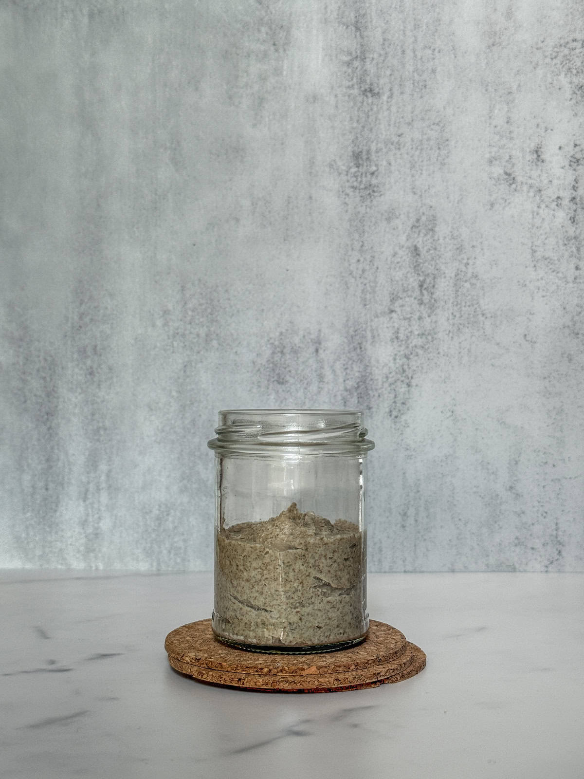 Mixed ingredients in a jar (front view).