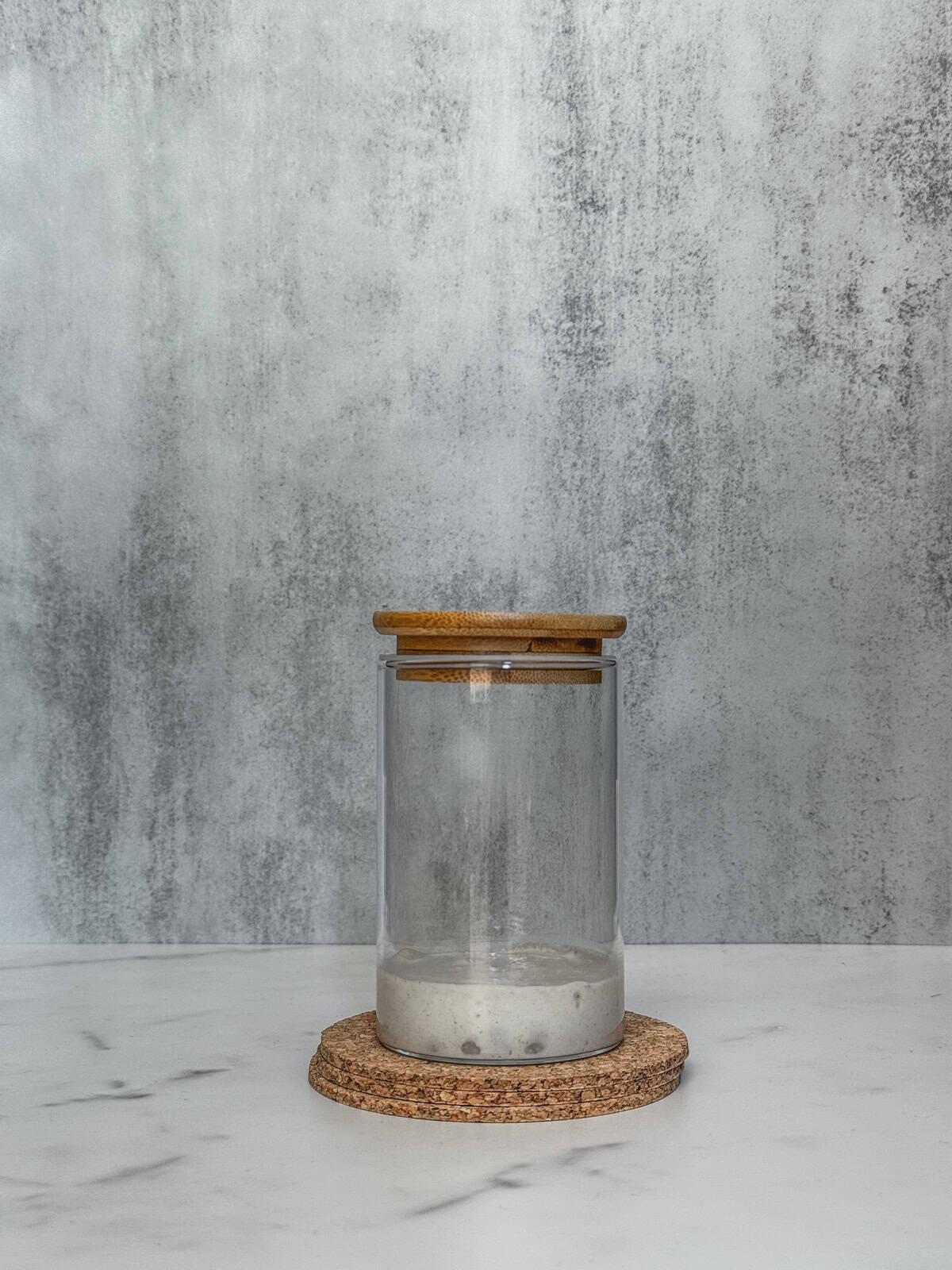 Jar of sourdough starter on day 3 morning, front view.