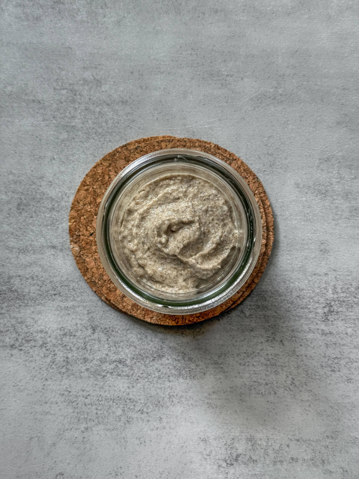 Starter ingredients combined in a jar (overhead view).