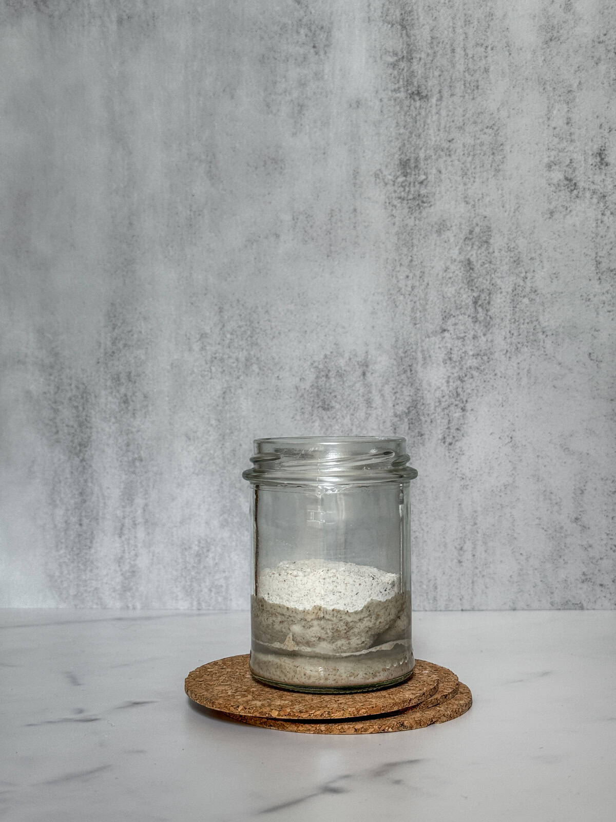 Unmixed starter ingredients in a jar.