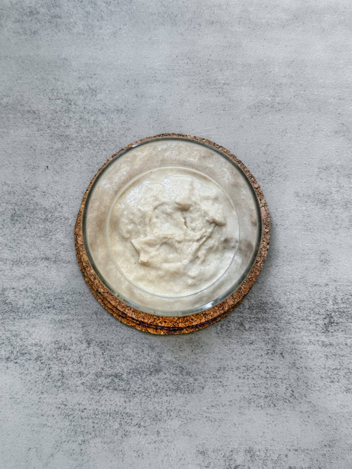 Jar of sourdough starter on day 2 morning after mixing, overhead view.