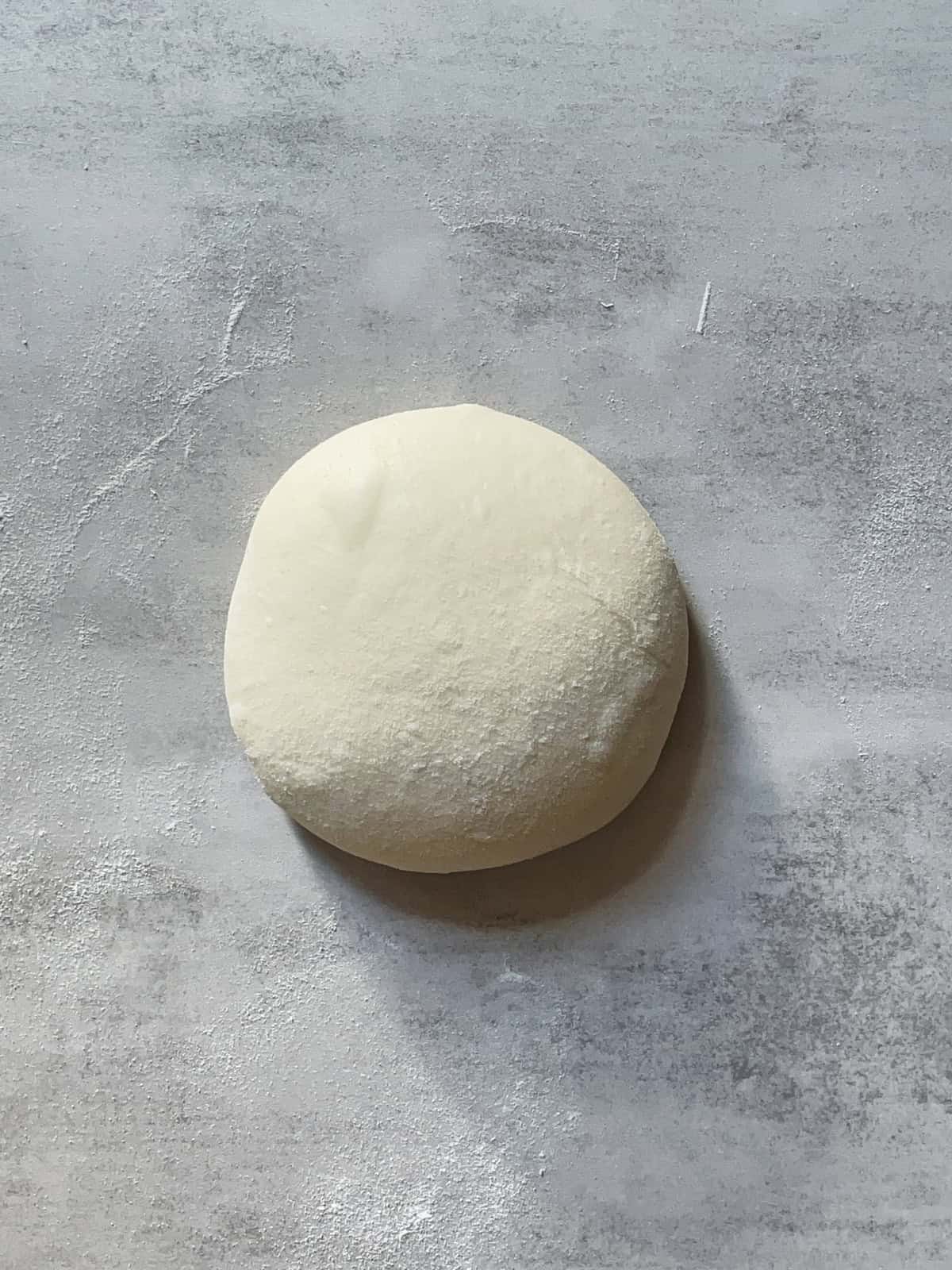 Preshaped sourdough dough on a table.