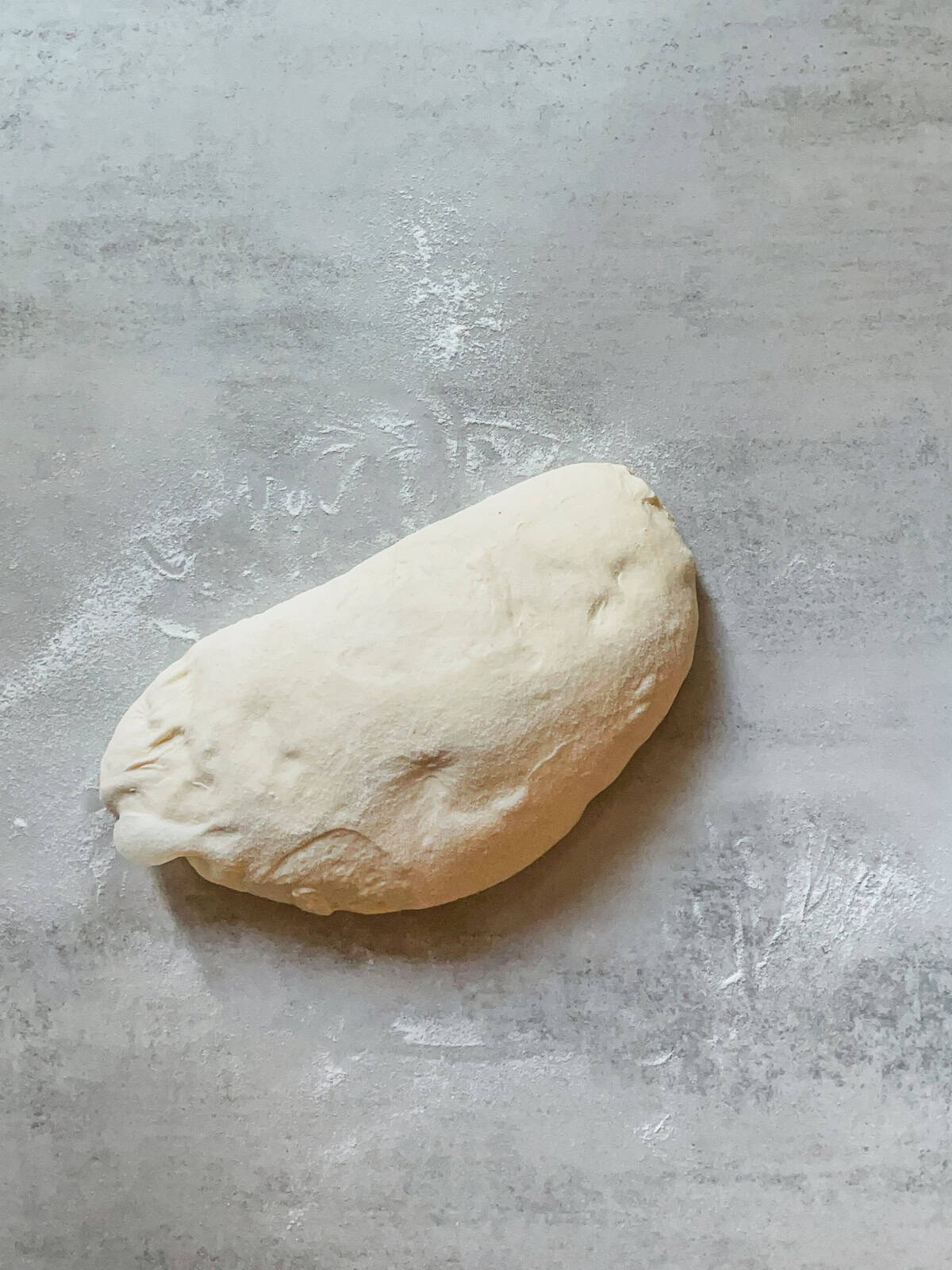 Folded dough on a table.