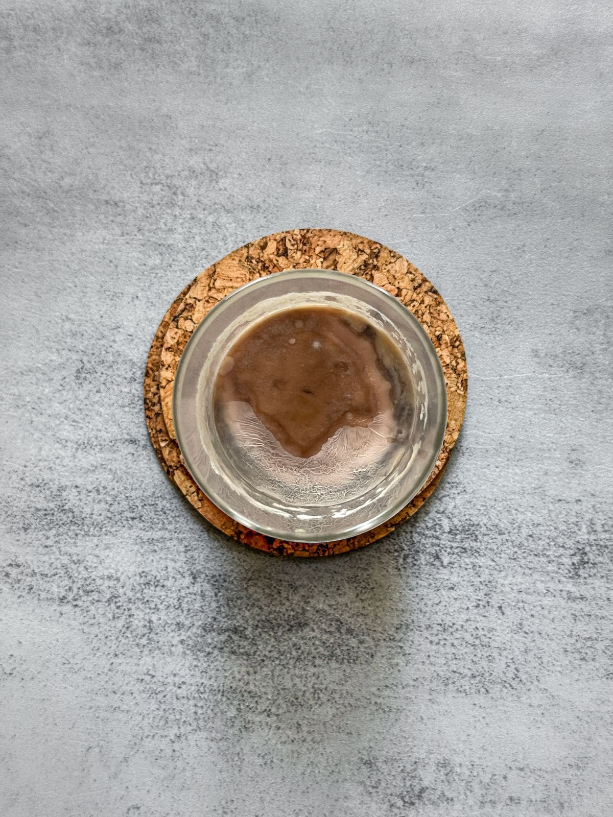 A jar of moldy sourdough starter.