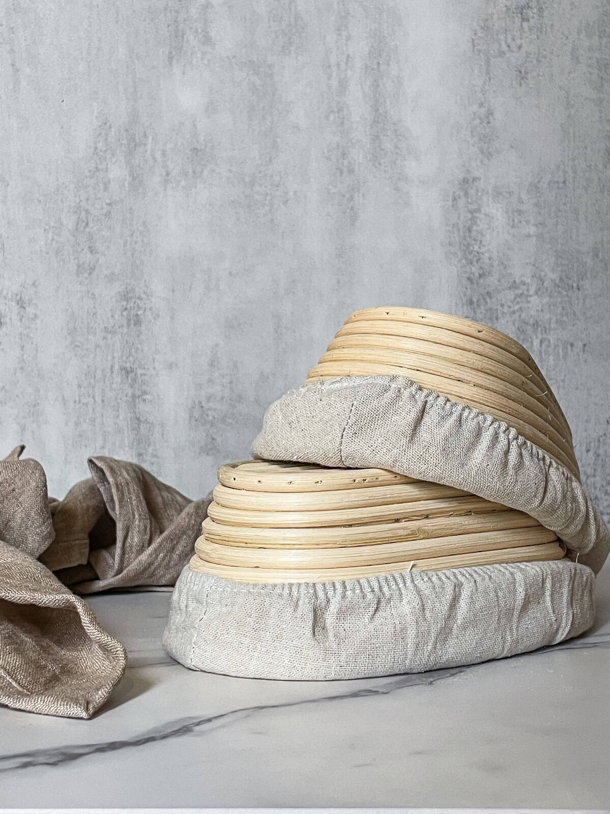 Rattan bannetons stacked upside down.