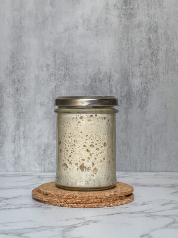 Sourdough starter in a jar with the lid closed.