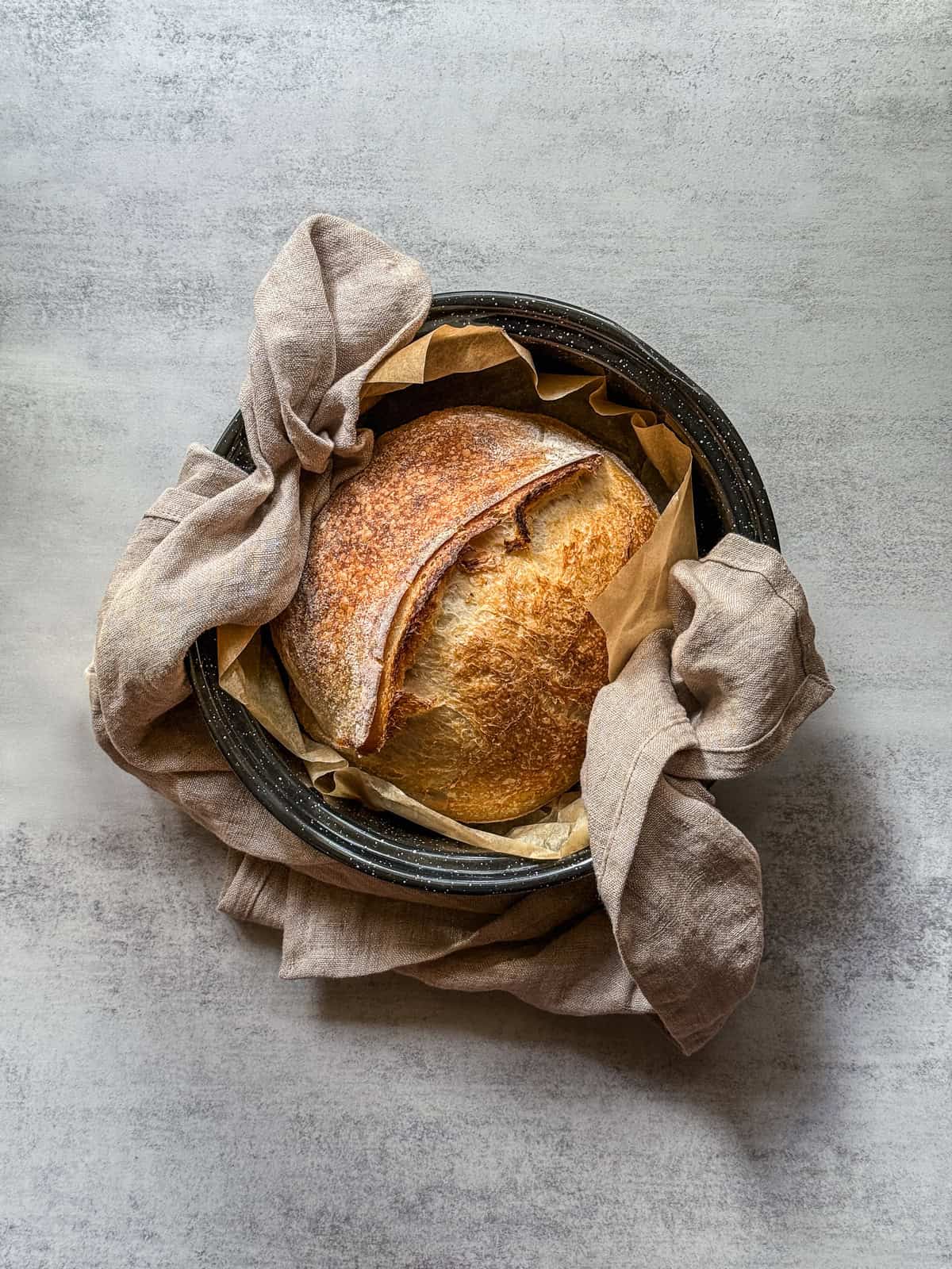 Fresh cold bake sourdough bread in a roasting pan.