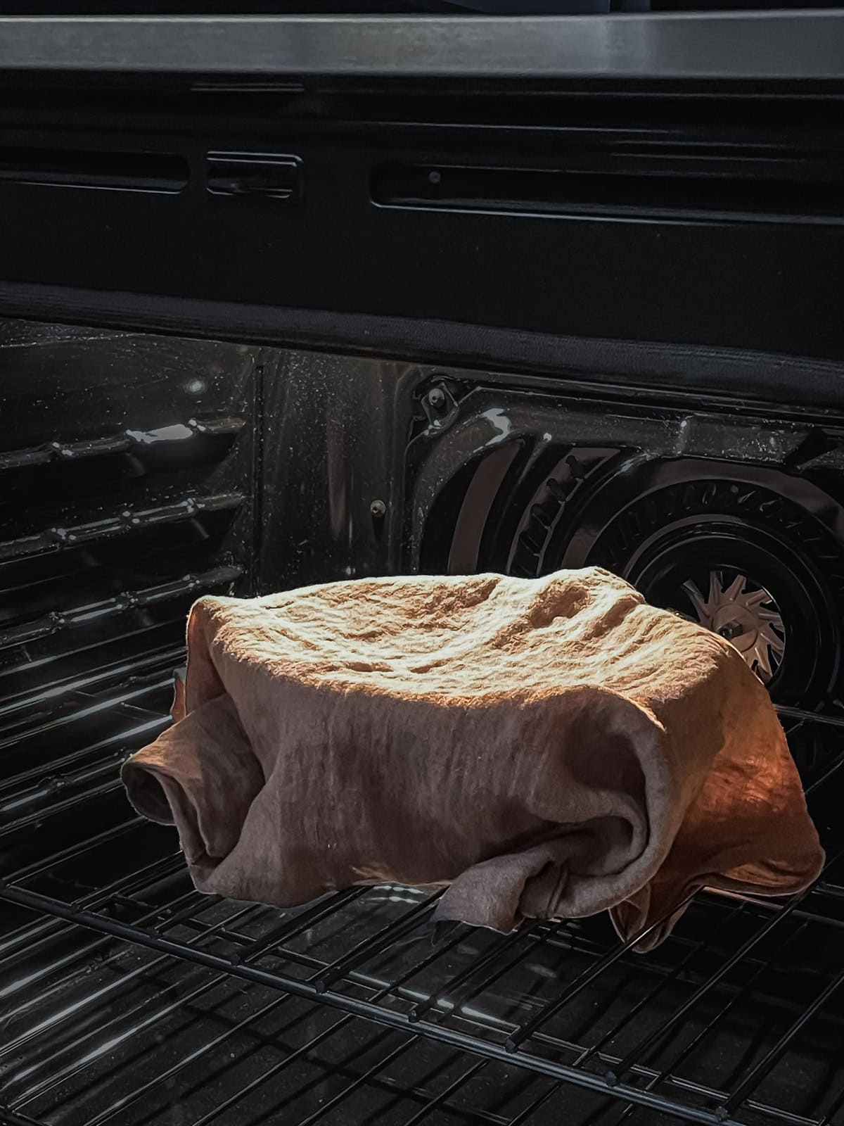 Sourdough proofing in an oven with the light on.