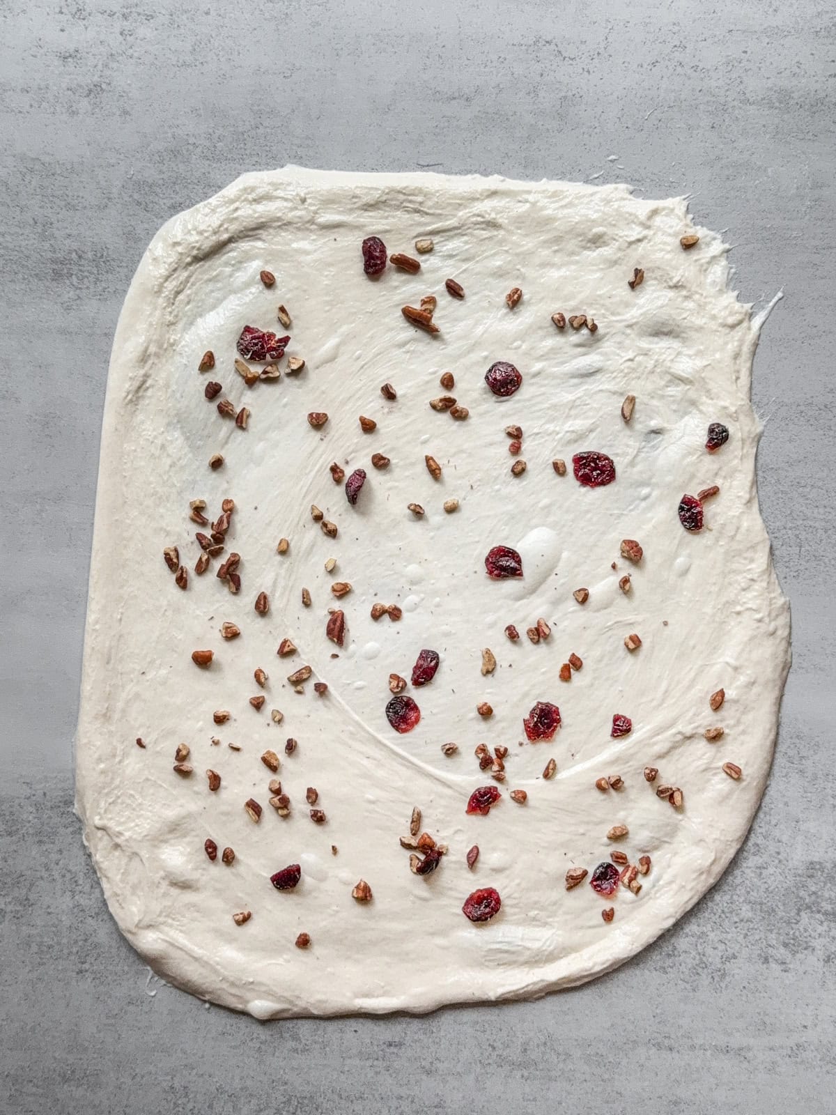 Laminated sourdough with inclusions on top.