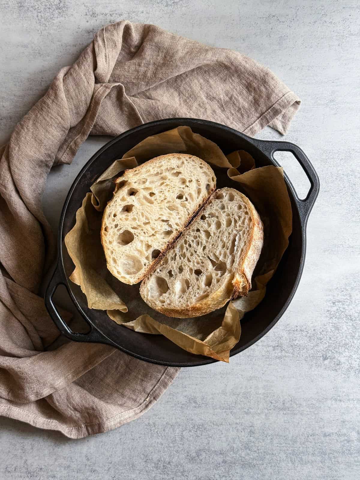 Halved KitchenAid stand mixer sourdough bread in a Dutch oven.