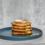 Sourdough pancakes with butter and honey on top.
