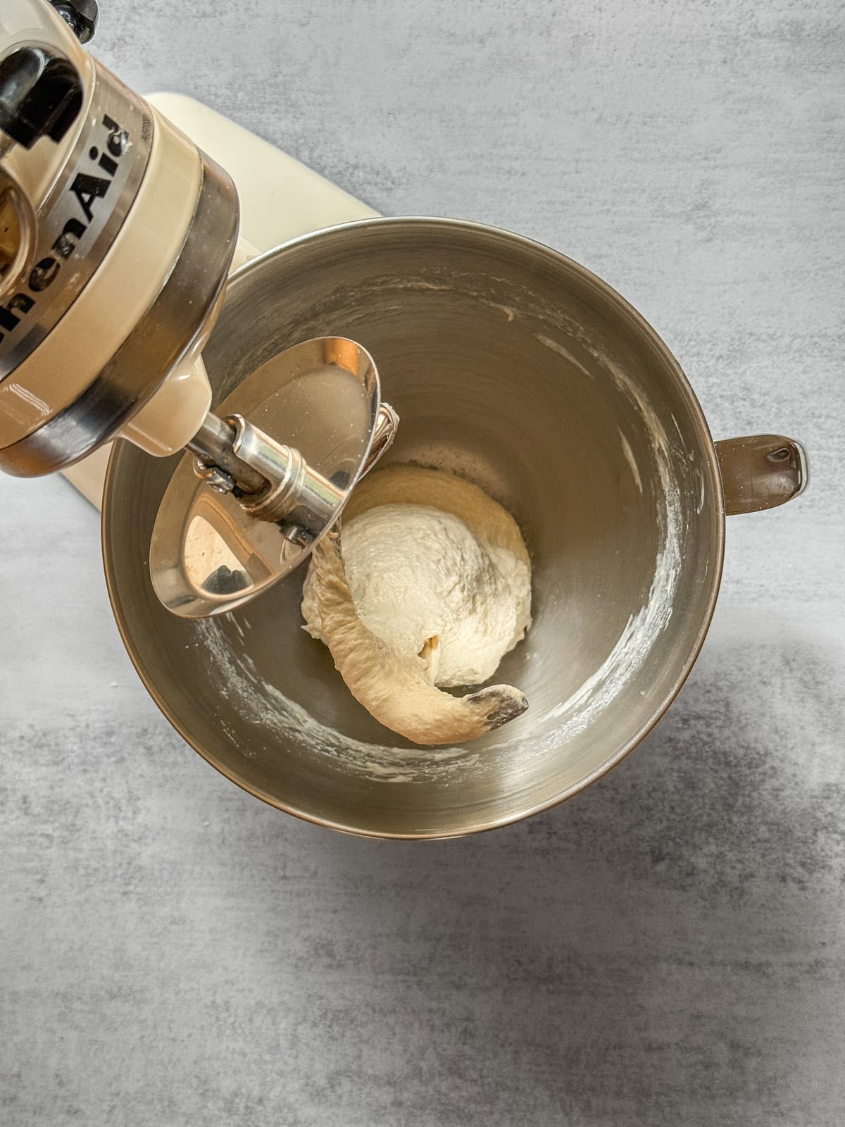Sourdough dough in a stand mixer bowl after adding levain.