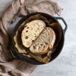 Halved stand mixer sourdough bread in a Dutch oven.