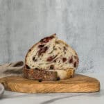 Half of Taylor Swift’s lemon blueberry sourdough bread on a serving board