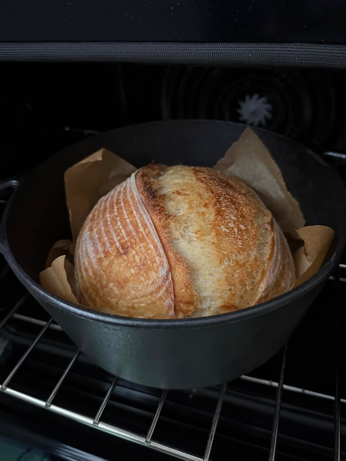 Sourdough bread with sourdough scoring baked in a Dutch oven.