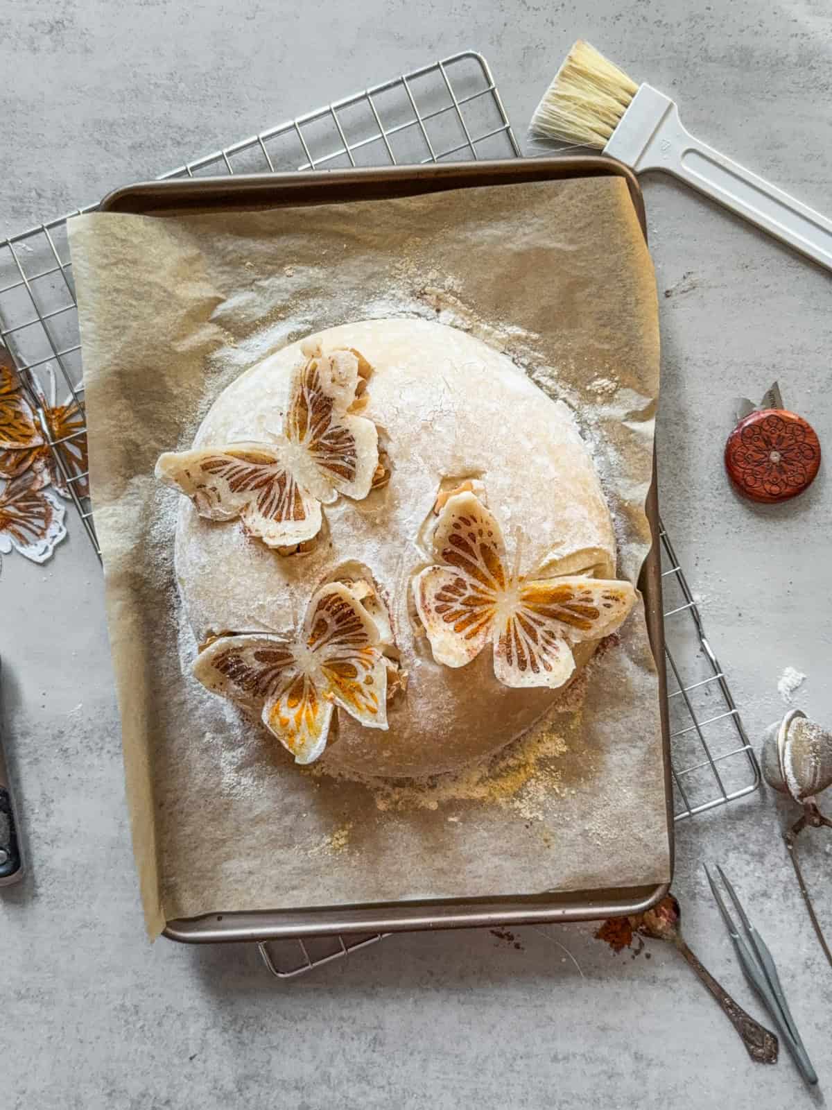 3D butterflies on sourdough with lifted wings.