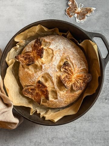 Sourdough 3D scoring design on a bread loaf in a Dutch oven.