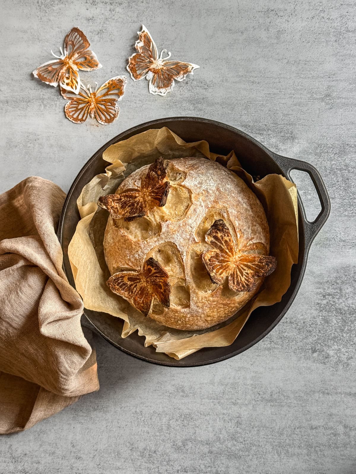 Butterfly sourdough bread with 3D scoring design in a Dutch oven