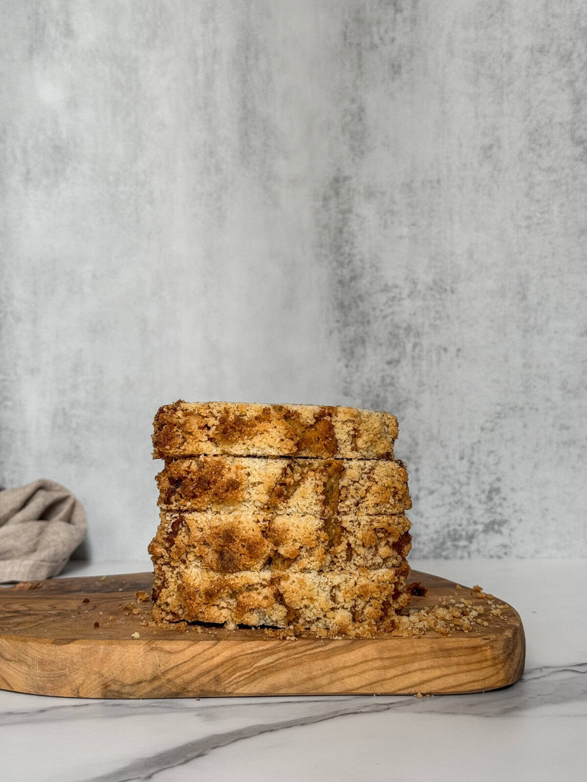 Sliced sourdough banana bread on a wooden board.